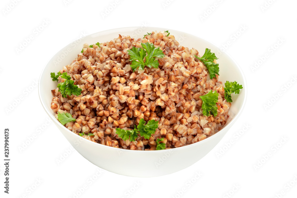 Cooked buckwheat in a bowl, garnished with fresh parsley, isolated on a white background with a clipping path Cooked buckwheat in a bowl, garnished with fresh parsley, isolated on a white background with a clipping path