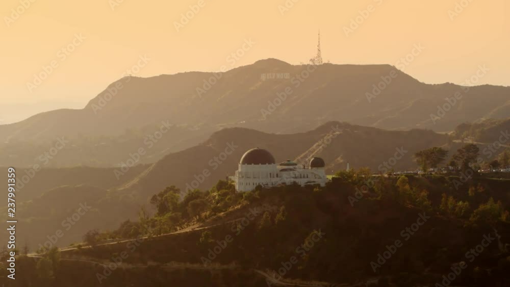 Observatory View Cinematic Aerial of Griffith Observatory with The Hollywood Sign as ...