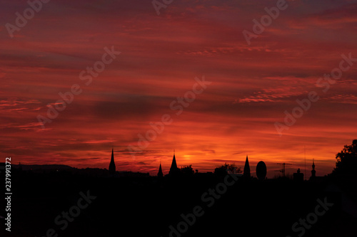 Silhouette of city skyline during sunset