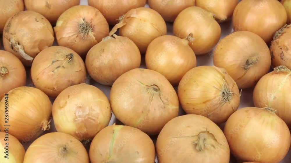 Rotation close-up, background of onion bulbs. Rotation close-up, background of onion bulbs.