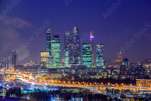 Moscow international business center "Moscow-city». Night or evening cityscape. Blue sky and street lights. Urban architecture.