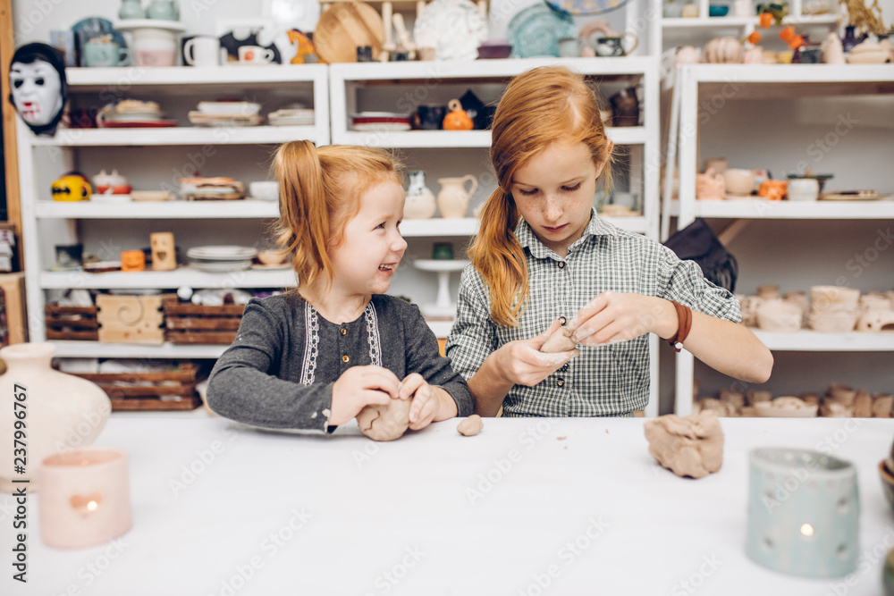 little talented children using the clay to make a craftwork. close up shot.interest, lifestyle, studing. school little talented children using the clay to make a craftwork. close up shot.interest, lifestyle, studing. school