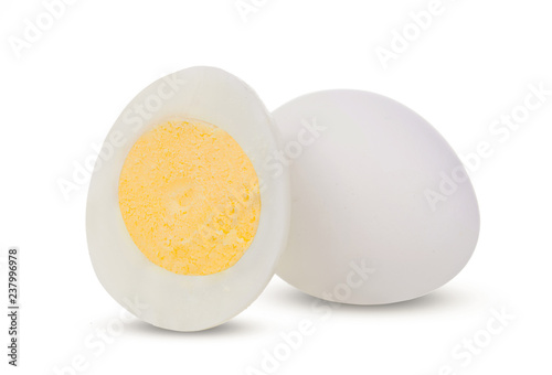 Two boiled whole and sliced eggs isolated on white background