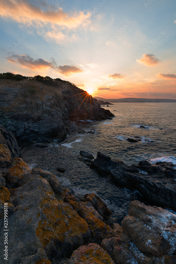 Sea sunrise, near the rocks