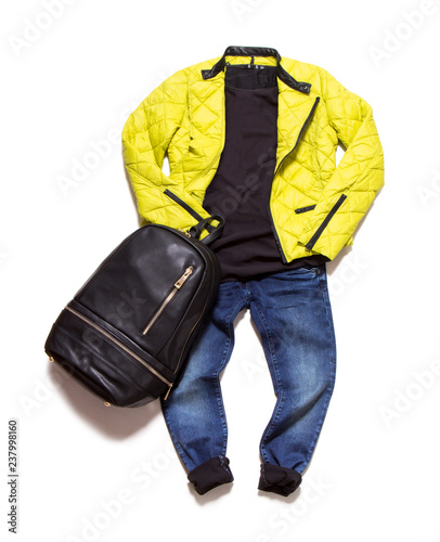 Men's casual clothes folded. Jacket, backpack and jeans isolated on white background