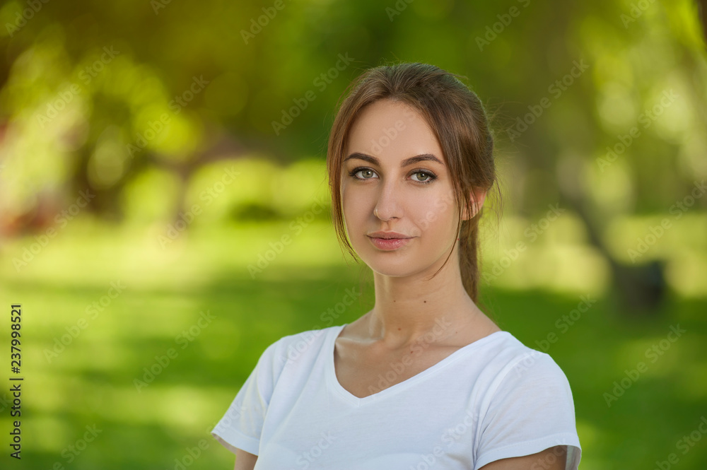 Charming Student Girl Sitting on Green Grass Charming Student Girl Sitting on Green Grass