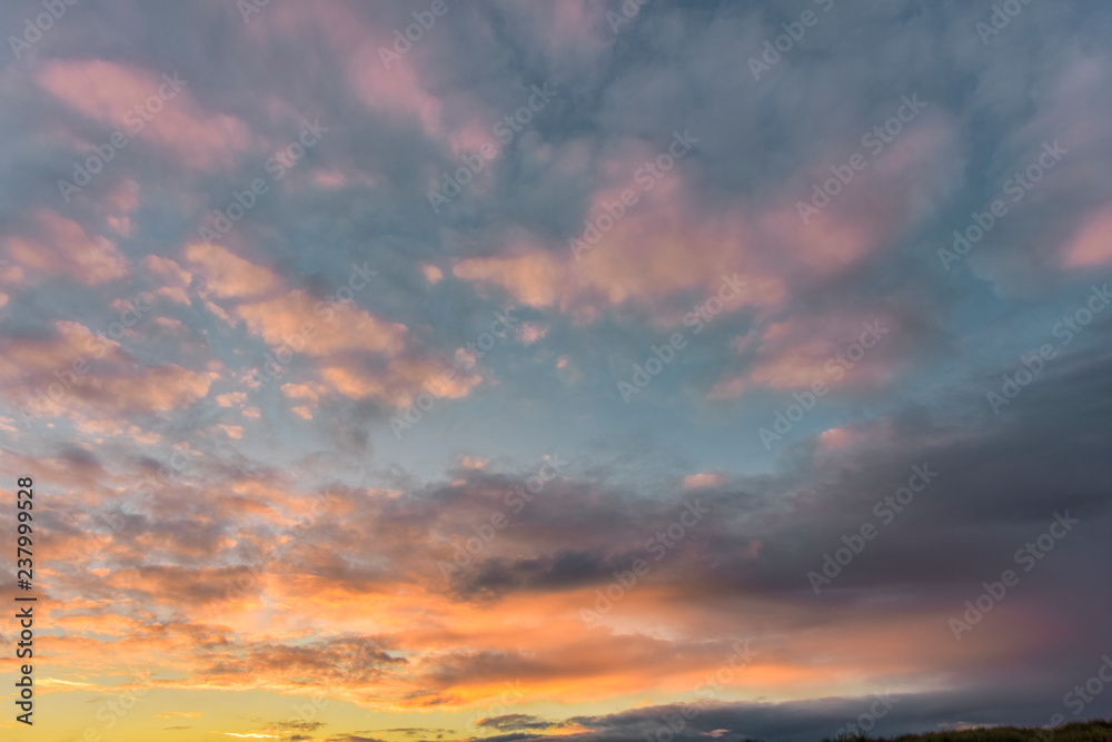 Texture of pink and purple clouds on sky during sunset