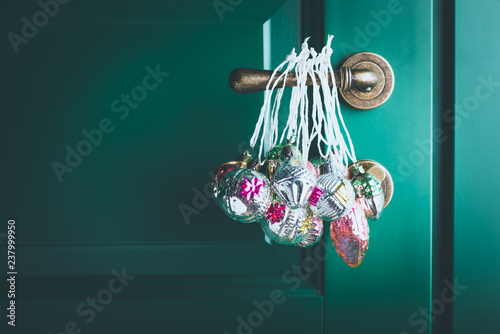 Vintage Christmas decorations hanged on door knob