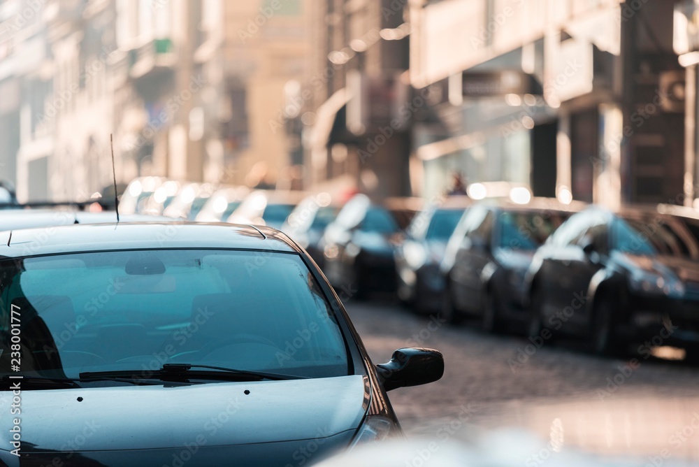 car isolated on street. car windshield close up. street scene full of cars with bokeh lights