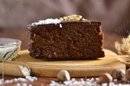 Chocolate-beet cake, decorated with hazelnut and coconut chips