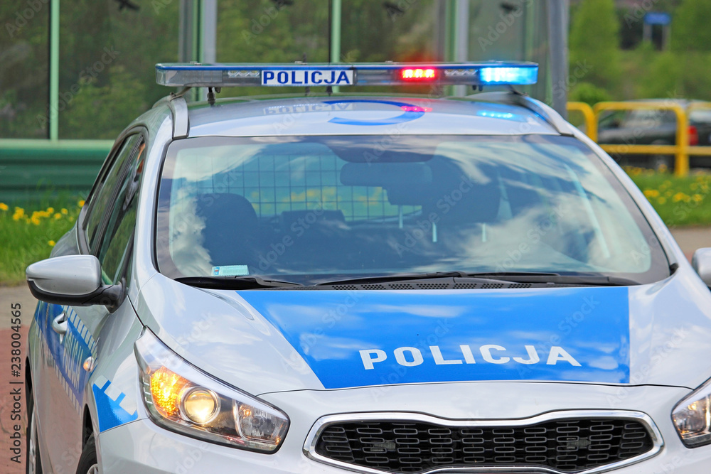 close up on Policja (Police) sign on car. Poland close up on Policja (Police) sign on car. Poland