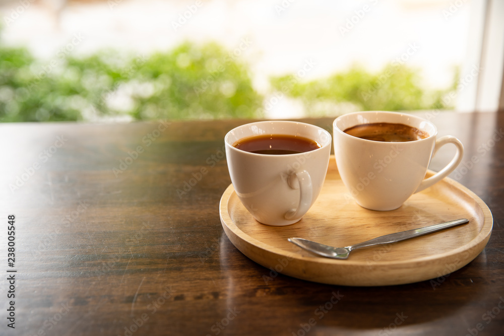 Fototapeta premium Coffee cup in wooden tray in vintage style cafe