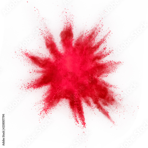 Explosion of red powder on white background