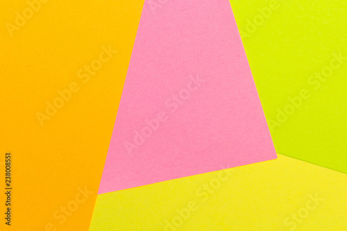 Yellow, pink, orange and green color texture paper background. Geometric paper background, pastel colors .