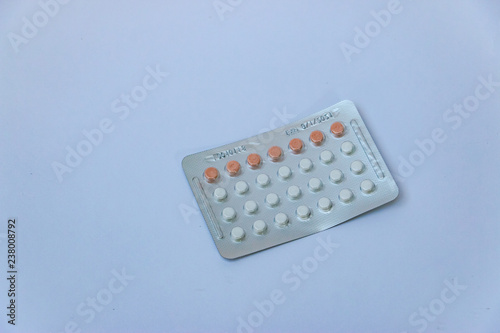 Birth control pills on a white background. Picture of hormones tablets to prevent pregnancy