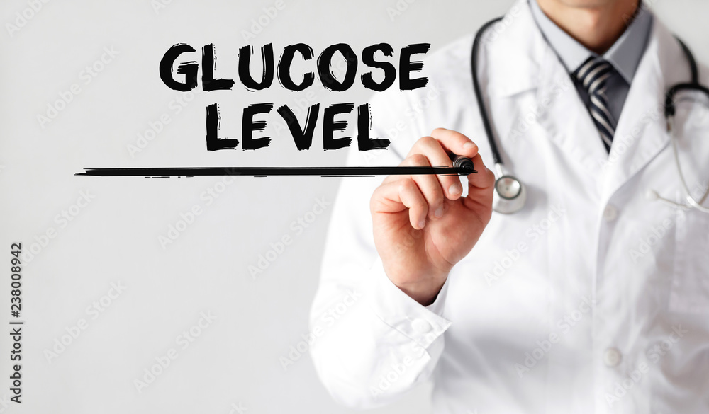 Doctor writing word Glucose Level with marker, Medical concept Doctor writing word Glucose Level with marker, Medical concept