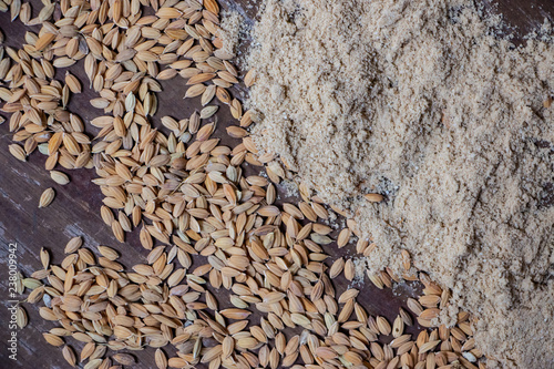 Rice and bran on wooden floor. Natural products made from rice fields. photo