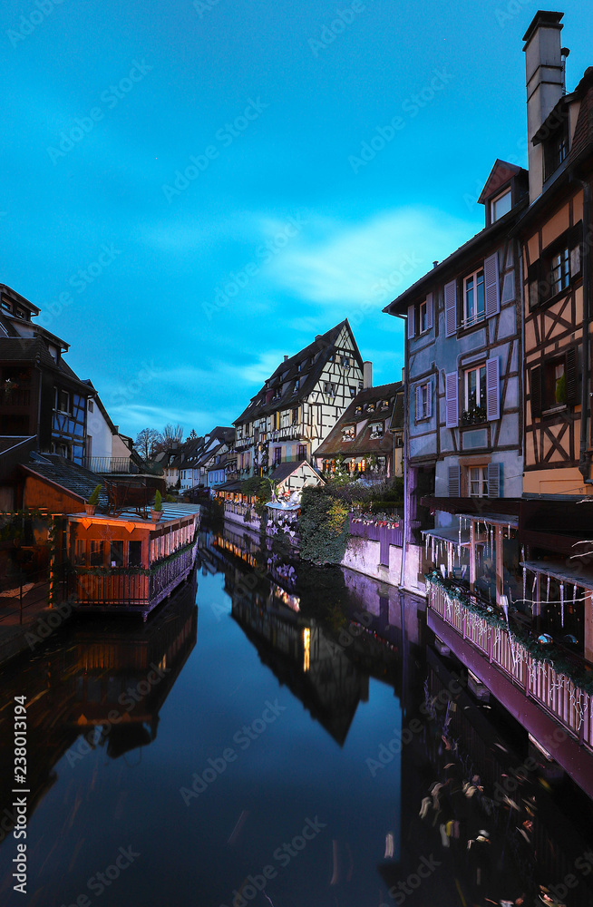 Panorama of traditional Alsatian half-timbered houses and river Lauch in little Venice quarter, old town of Colmar, Alsace, France
