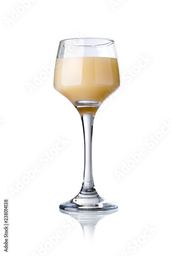 glass of cream liqueur isolated