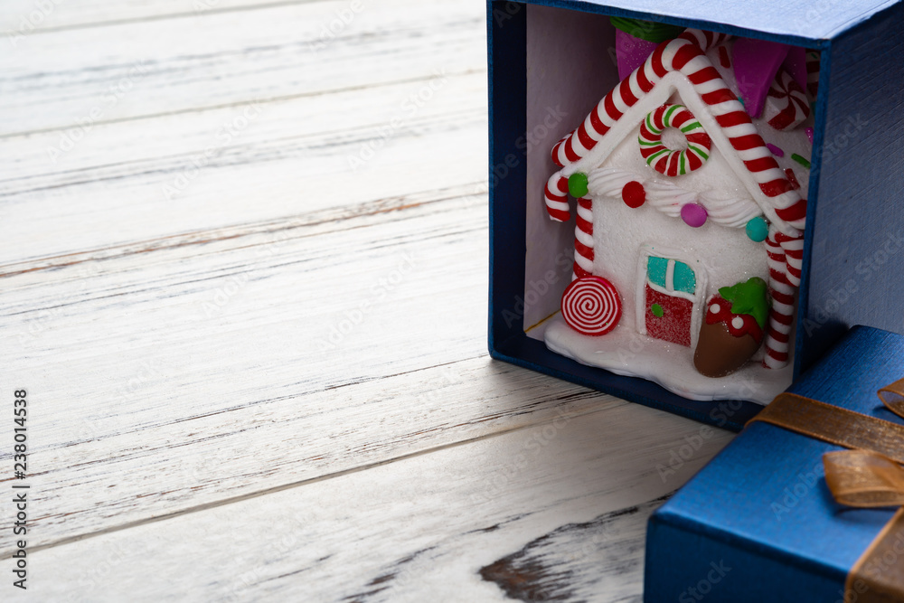 Obraz premium house model with Christmas decoration inside a present box