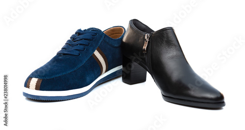 blue shoe for husband and black one for wife on white as filiation concept