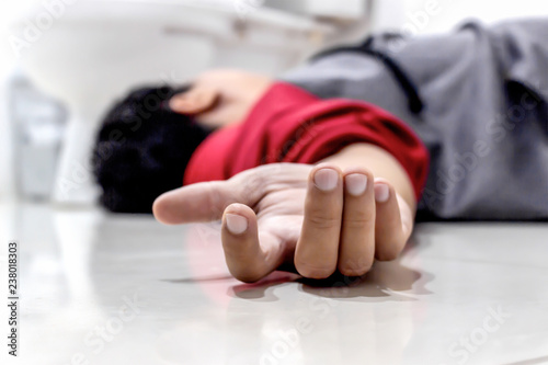 man falling in the bathroom because the cerebrovascular accident or stroke with with soft-focus and over light in the background photo