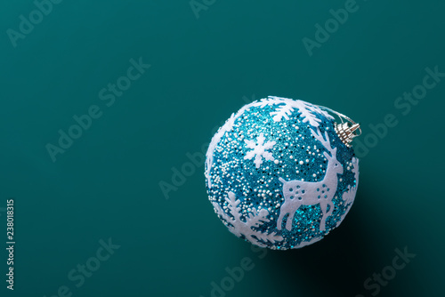 blue Christmas ball on a navy blue background