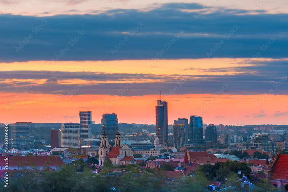 Aerial view over Old town of Vilnius and skyscrapers of New Center at sunrise, Lithuania, Baltic states.