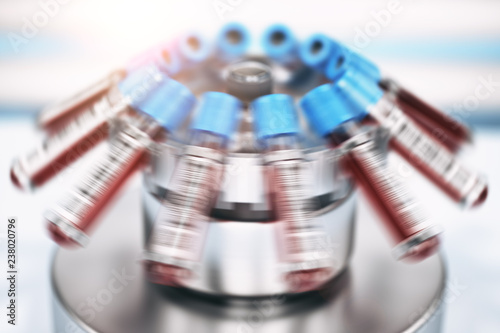 Blood test tubes in centrifuge. Medical laboratory concept.