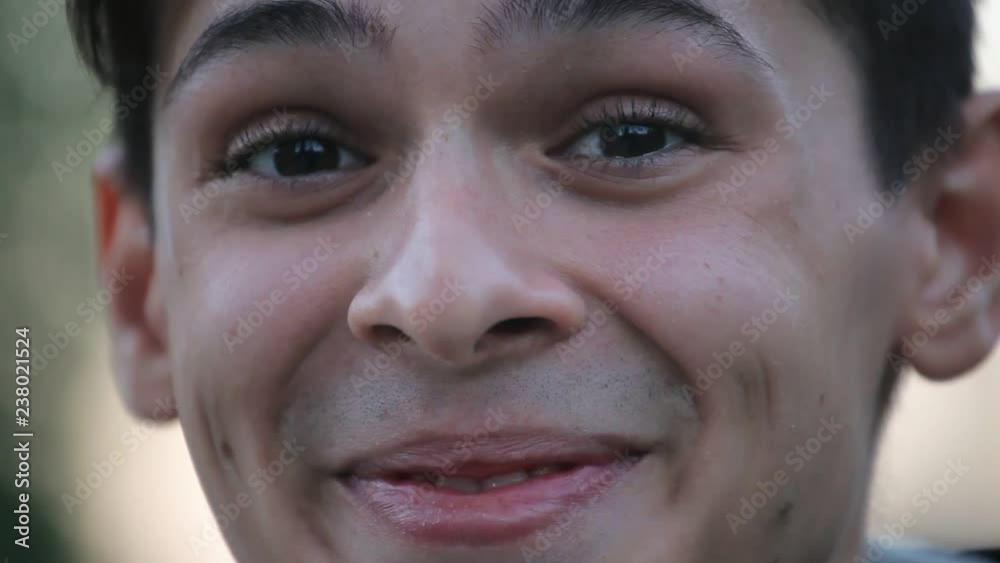 smiley face closeup , young boy outdoors in the evening smiley face closeup , young boy outdoors in the evening