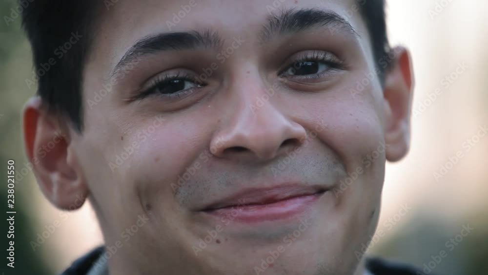 smiley face closeup , young boy outdoors in the evening smiley face closeup , young boy outdoors in the evening