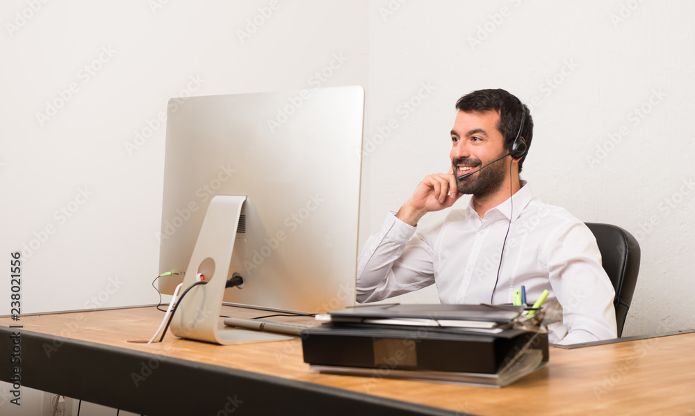 Telemarketer man in a office Telemarketer man in a office