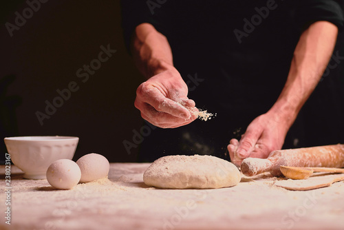 hands kneading dough