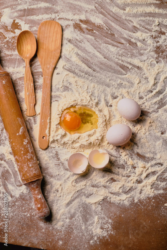 eggs and flour on wooden table