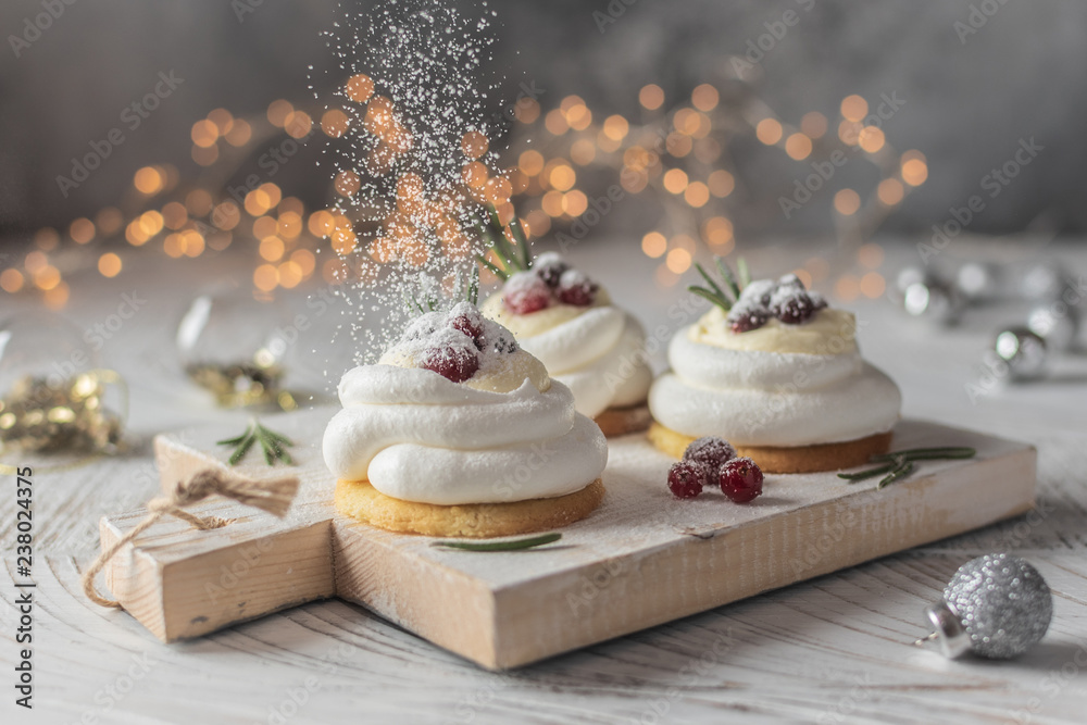 Pavlova Cake with berry cranberries on white background