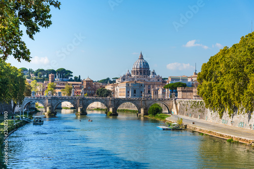 Saint Peter dome seen from Tiber river in Rome photo
