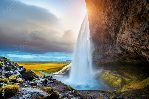 Seljalandsfoss waterfall during the sunset, Beautiful waterfall in Iceland.