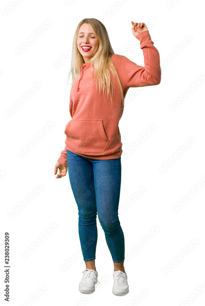 A full-length shot of a Young girl enjoy dancing while listening to music at a party on isolated white background A full-length shot of a Young girl enjoy dancing while listening to music at a party on isolated white background