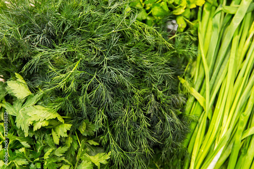 Texture of greenery. Vegetbales in the shop. Dill and onin photo