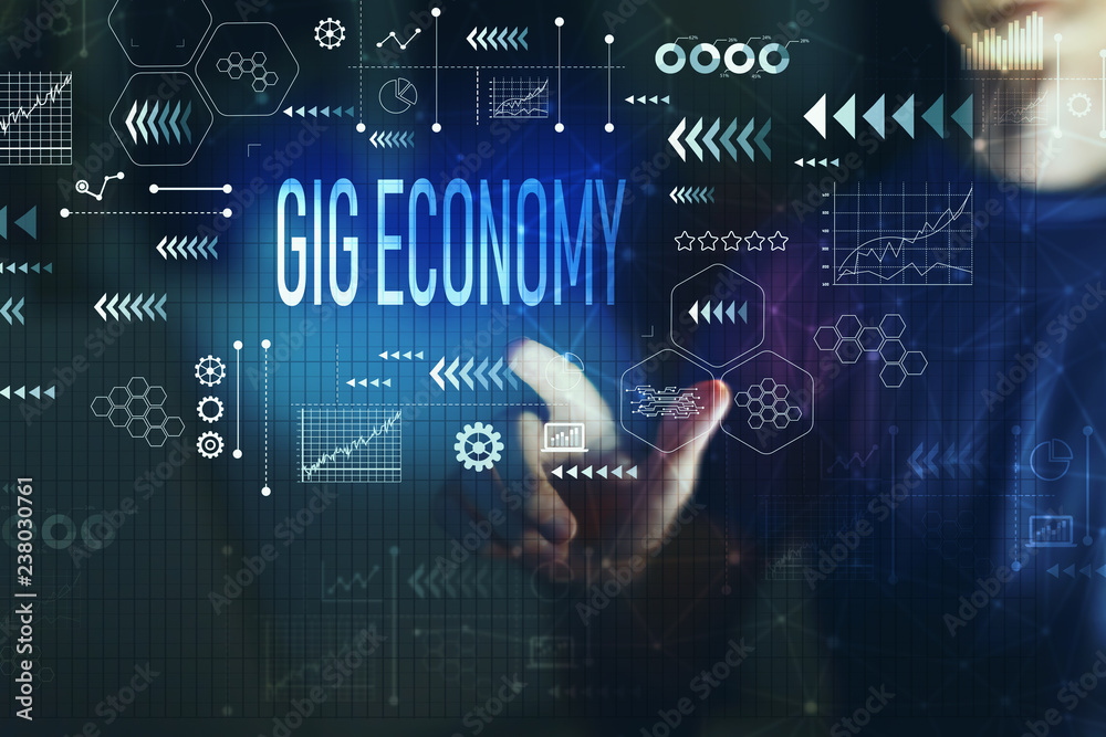 Gig economy with young man on a dark background Gig economy with young man on a dark background