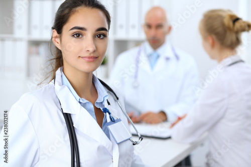 Portrait of young doctor woman  in hospital. Hispanic or latin american staff in medicine