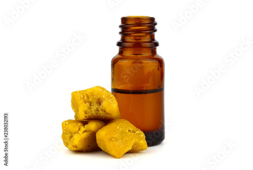 Asafoetida Dried Gum Medicine Tincture in a Bottle, Isolated on White Background. Also Known as Food of the Gods, Devil's Dung, Jowani Badian, Hing, Hengu, Inguva, Kayam, and Ting.