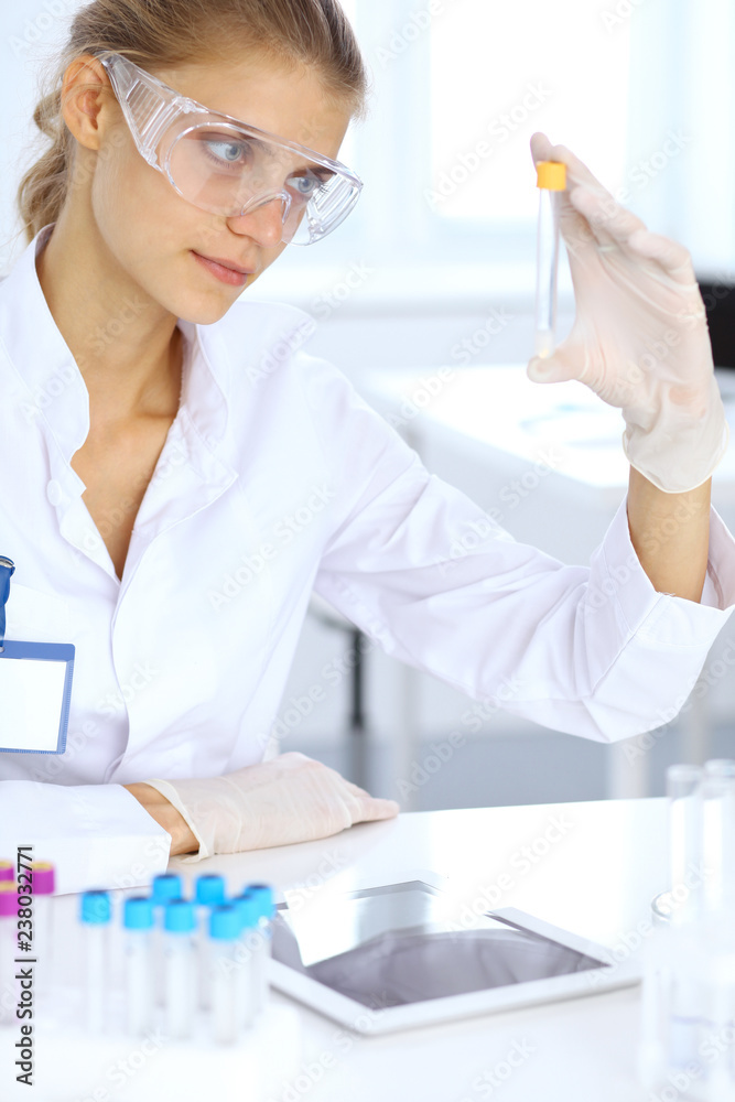 Female scientific researcher or blood test assistant in laboratory. Medicine concept Female scientific researcher or blood test assistant in laboratory. Medicine concept