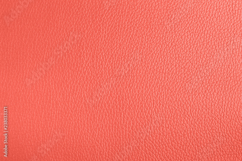 Leather texture background living coral color. Trend color concept of the year.