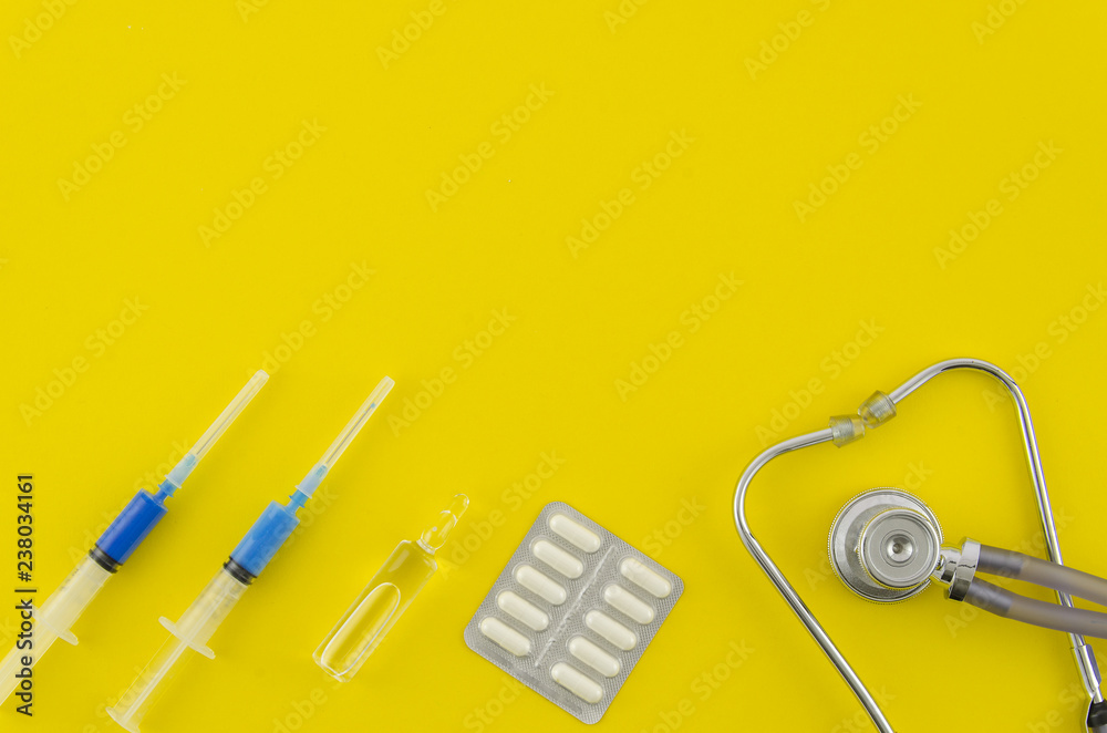 Medical concept, top view of medication, pill, ampoule, stethoscope. Layout for the Medical Clinic health care. Top view, flat lay, mock up template Medical concept, top view of medication, pill, ampoule, stethoscope. Layout for the Medical Clinic health care. Top view, flat lay, mock up template