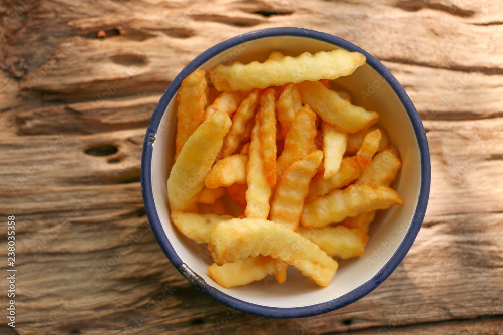 Zoom French Fries in cup on wood Zoom French Fries in cup on wood