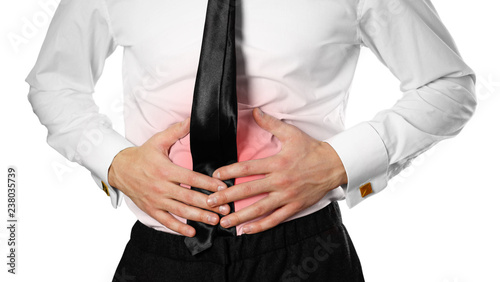 Businessman in a white shirt and tie holding his stomach. Abdominal pain. Isolated background