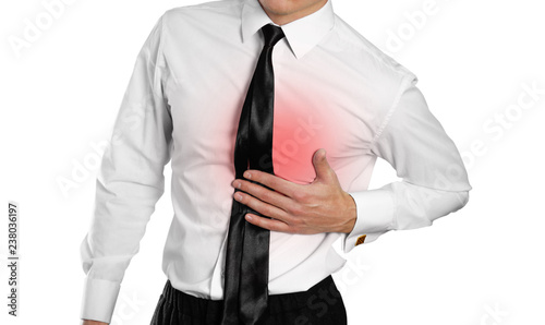 Businessman in a white shirt and tie holding his chest. Pain in heart. Isolated on white background