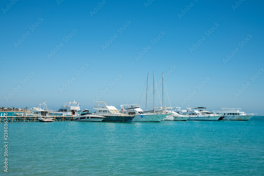 Yacht parking near the sea pier. Boats and yachts, near Venice Sands, Egypt.