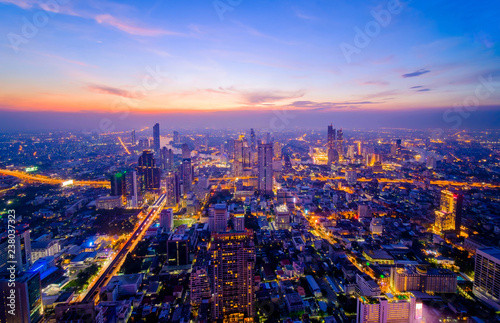 Cityscape aerial view from top building at night , Aerial view of Bangkok city in Thailand